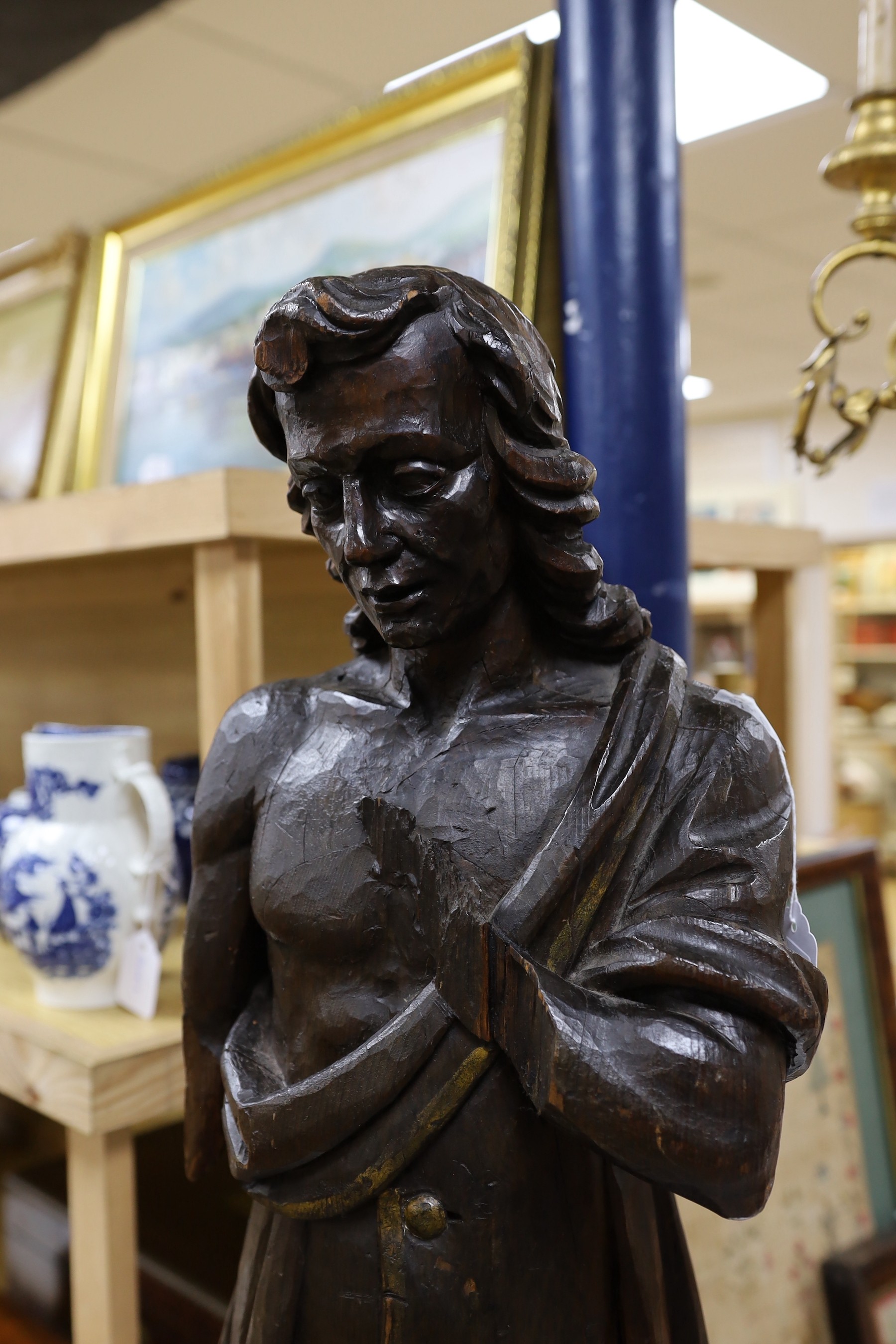 An early 18th century French figurative carving, 84cm high